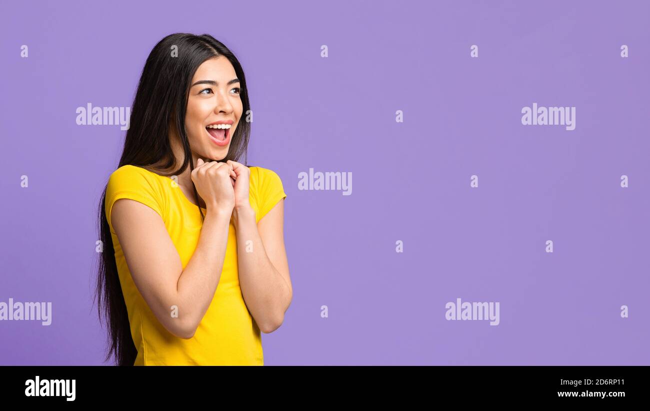 Excited Asian Female Looking At Copy Space And Exclaiming With ...