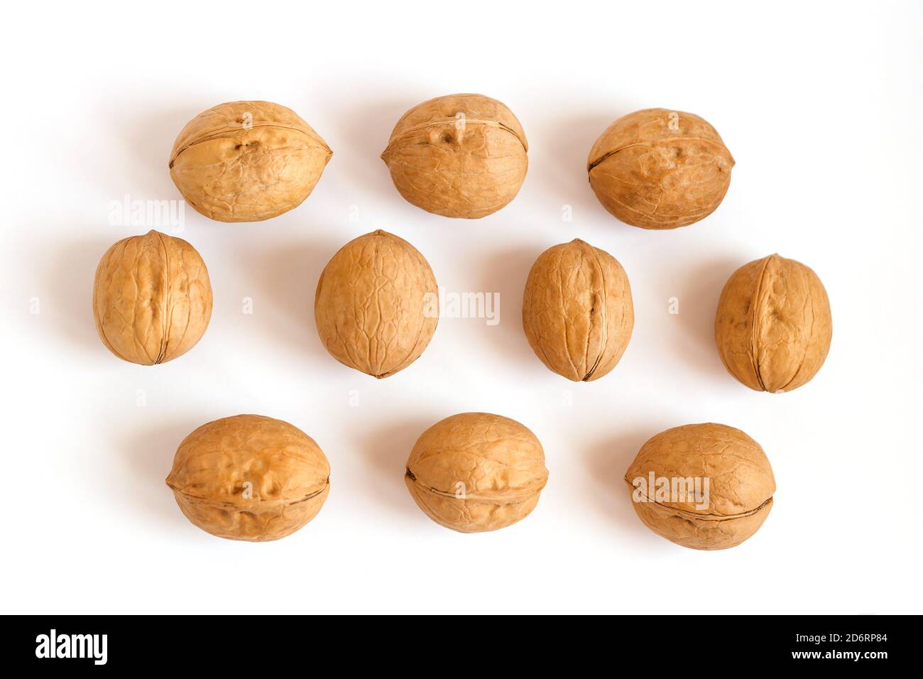 group of walnuts in shell on white background Stock Photo Alamy