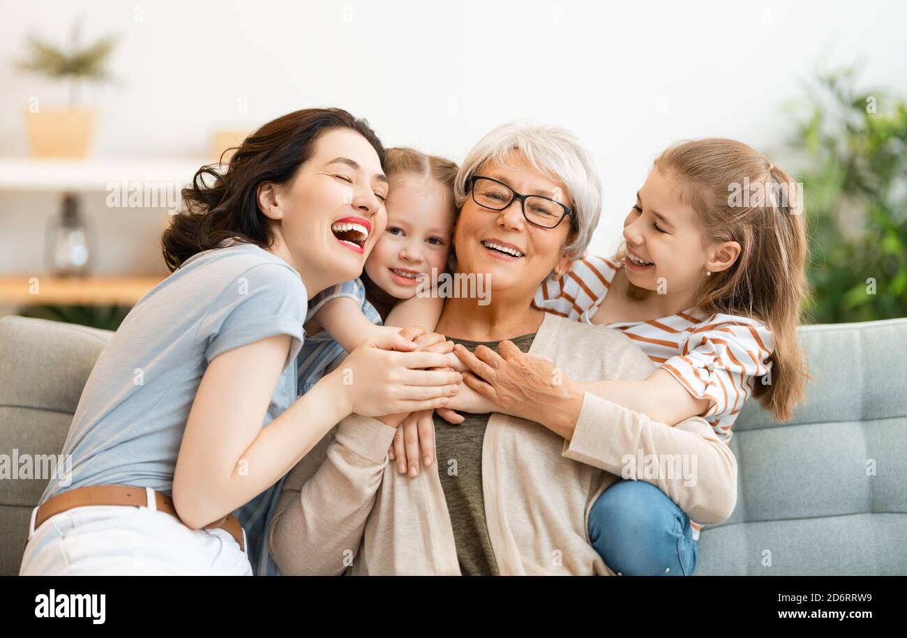 A nice girls, their mother and grandmother enjoying spending time ...