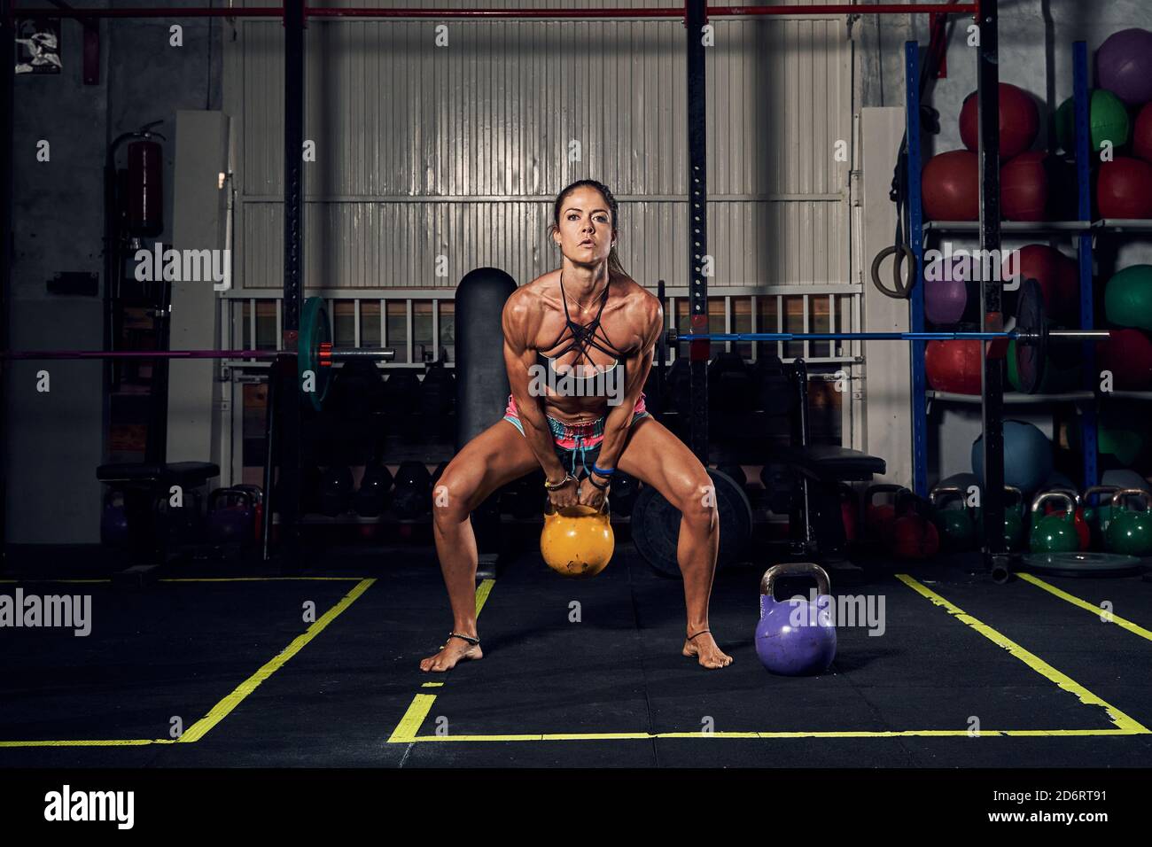 activewear doing squat exercise 