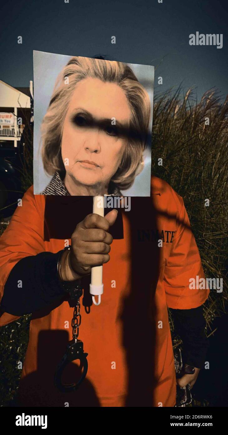 New York, New York, USA. 4th Oct, 2020. Oct. 17, 2020. Hllary Clinton as a prisoner costume at Trump rally and convoy in Port Jefferson. Republicans campaign for Conservative political candidates who support veterans, law and order, national security and defense, immigration enforcement, America first, right to life, and other right wing causes. Photos shot with the Disposables app created by David Dobrik. Credit: John Marshall Mantel/ZUMA Wire/Alamy Live News Stock Photo