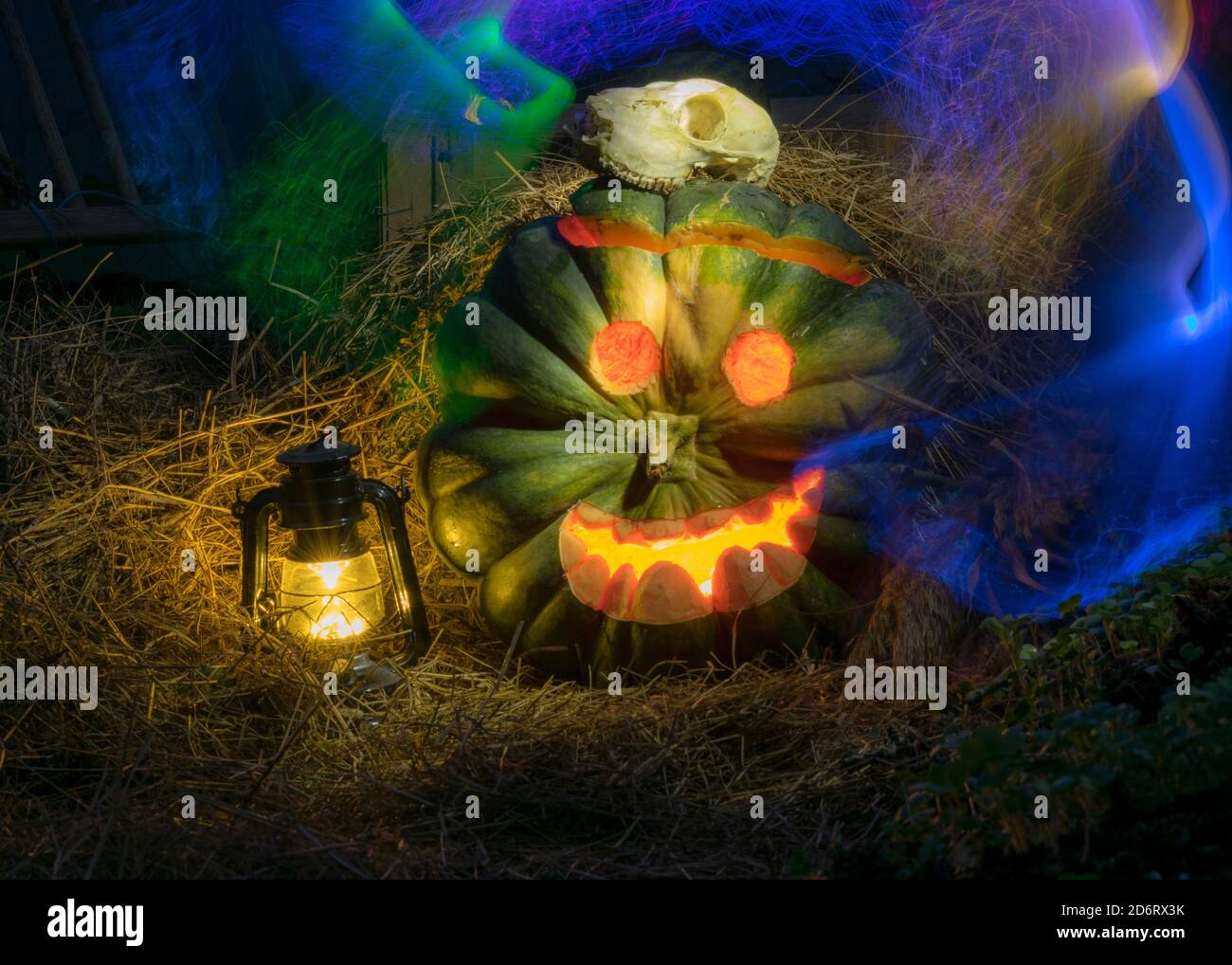 Halloween pumpkin head jack lantern with burning candles in a scary ...