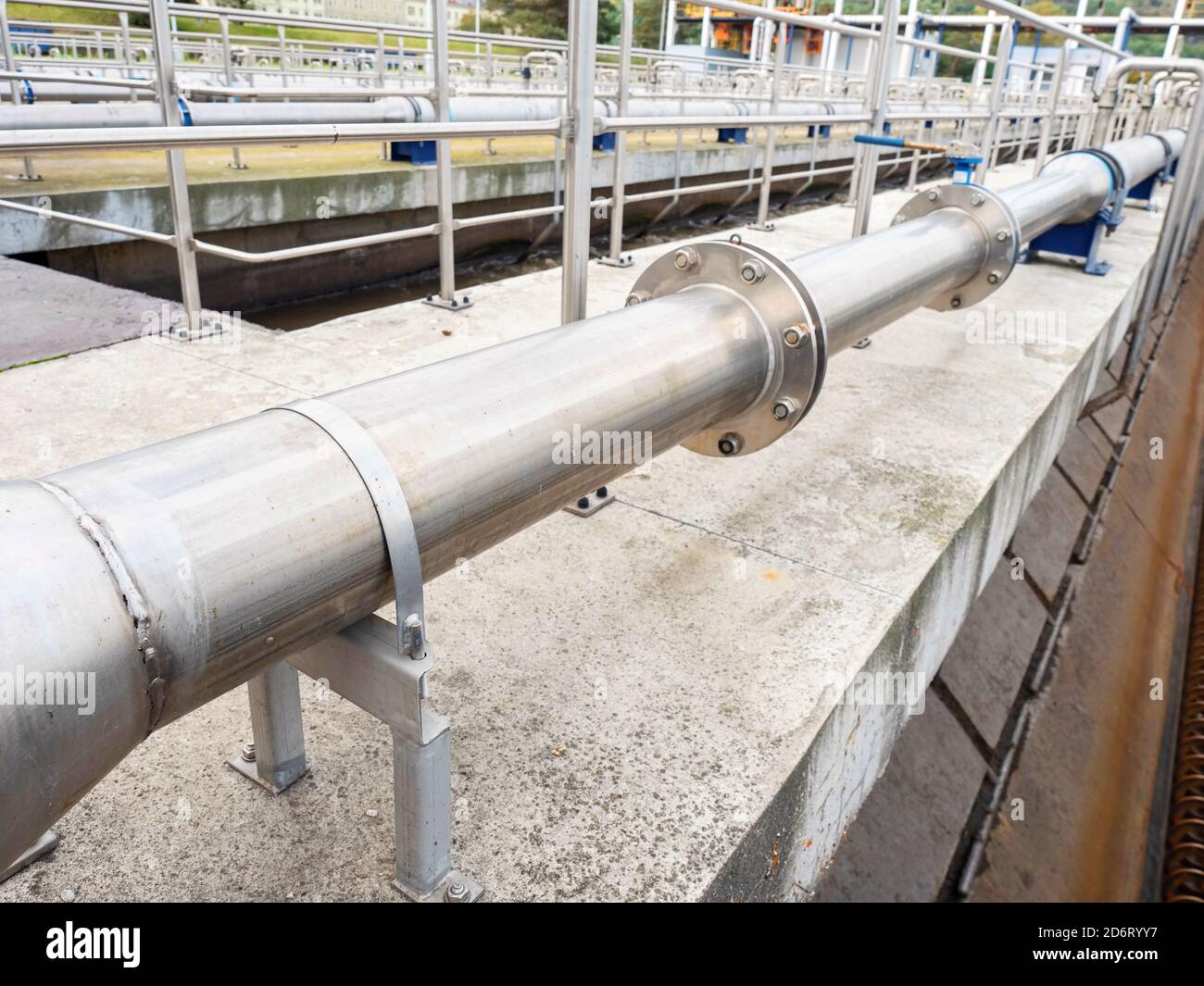 Chemical factory pool. Stainless steel pipes and pool in process. Industrial zone, industry production exterior Stock Photo