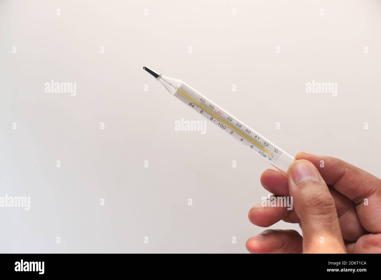 Man holding out thermometer hi-res stock photography and images - Alamy