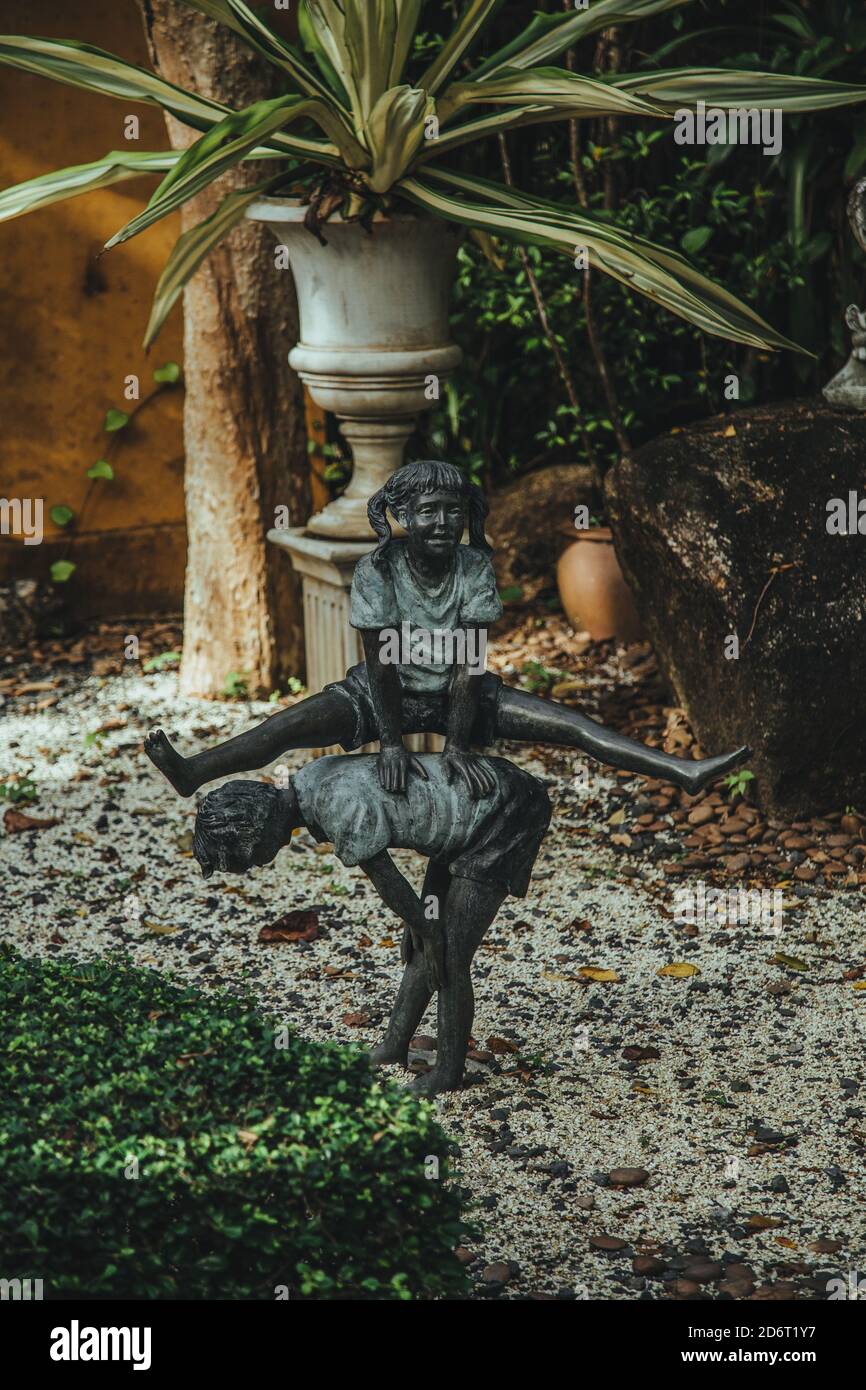 Thailand - 2019. Phuket Botanic Garden. leapfrog game. The sculptures of children at play. Background blurred for artistic idea. Stock Photo