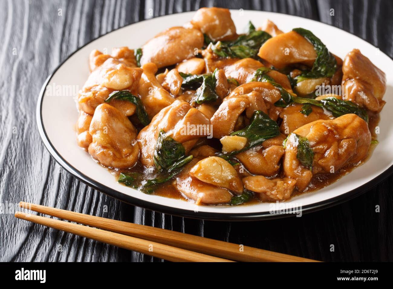 Authentic Chinese restaurant-style flavors abound in this three cup chicken recipe that is simple to make with absolutely aromatic results Stock Photo