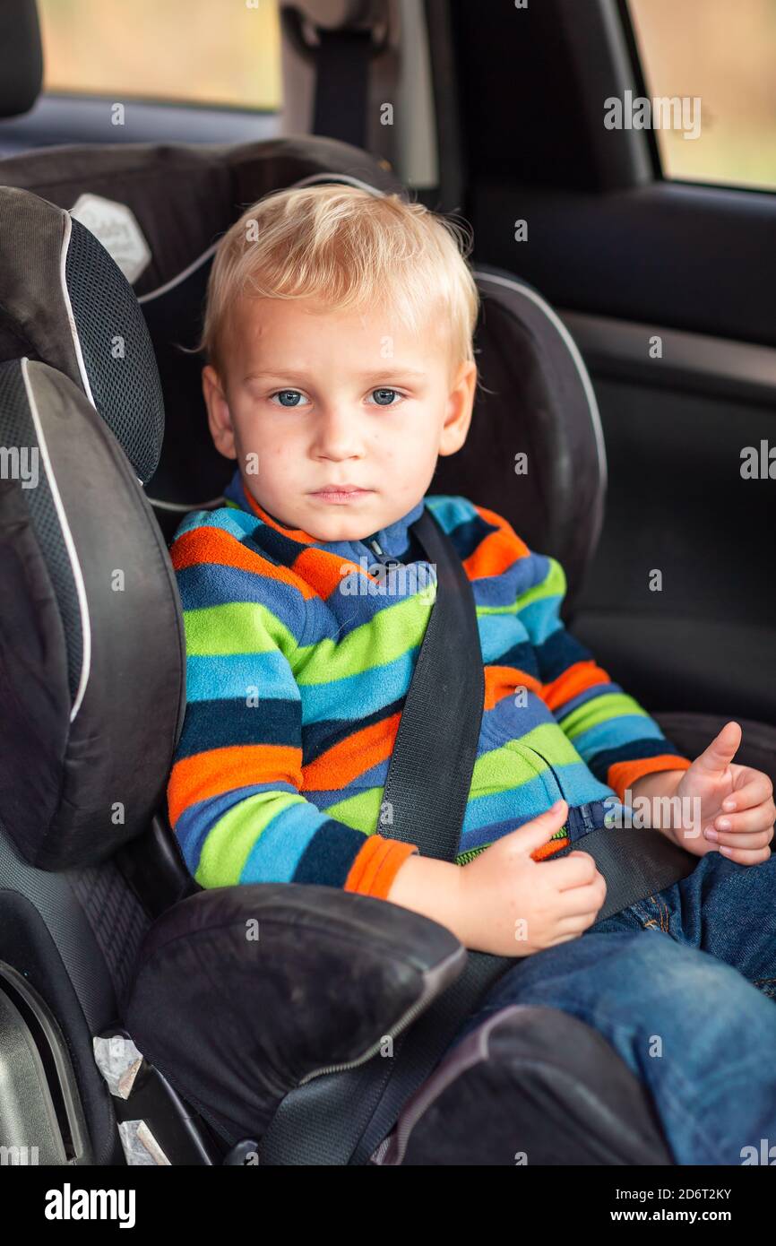 Little Baby Boy Sitting On A Car Seat Buckled Up In The Car Children s
