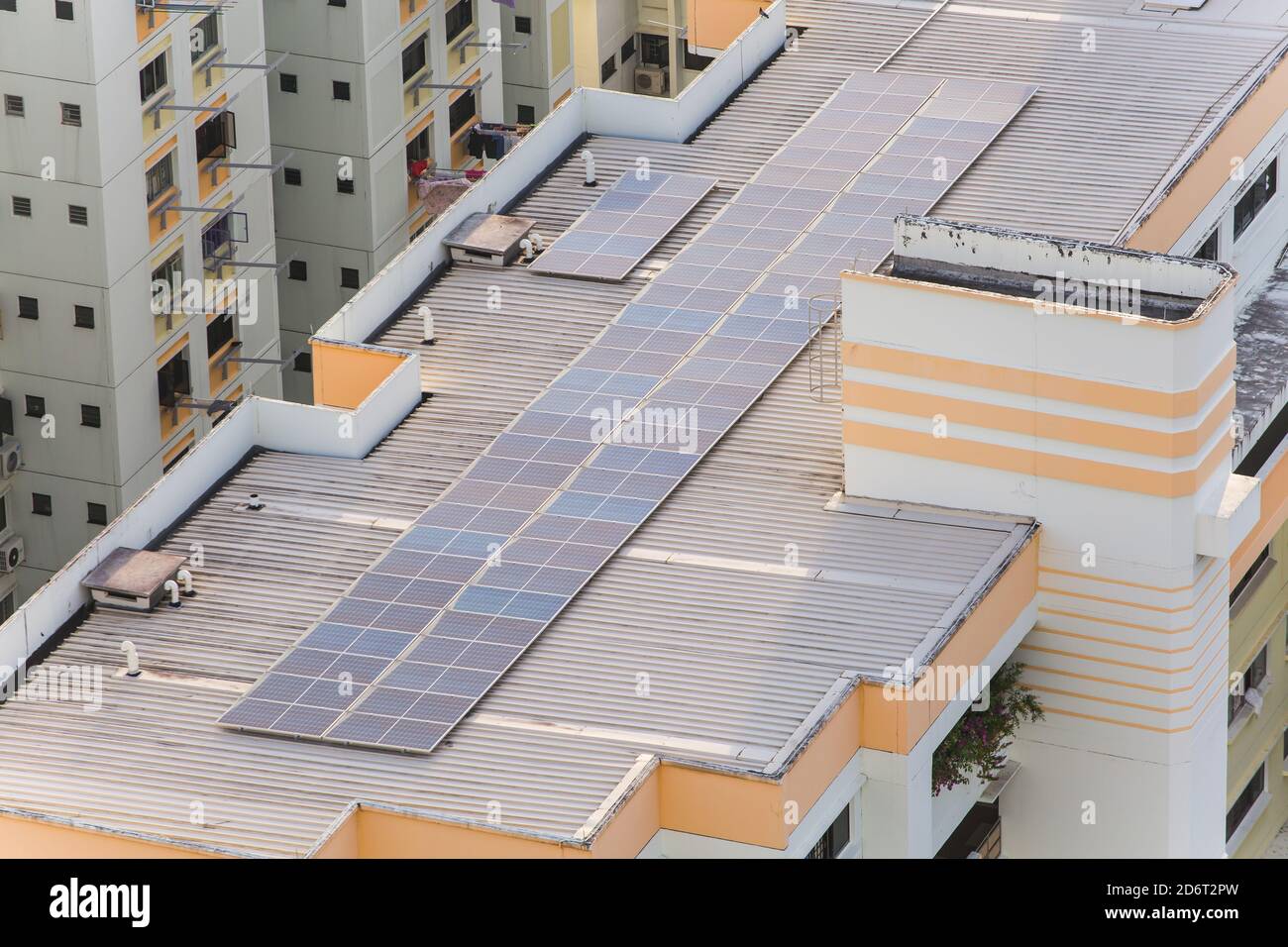 Solar panels are installed on top of modern housing estate, Singapore. Stock Photo
