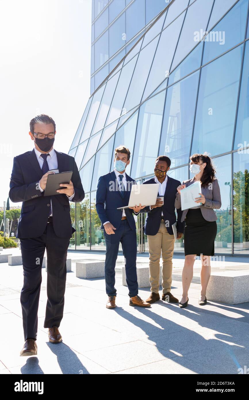 Diverse male coworkers walking hi-res stock photography and images - Alamy
