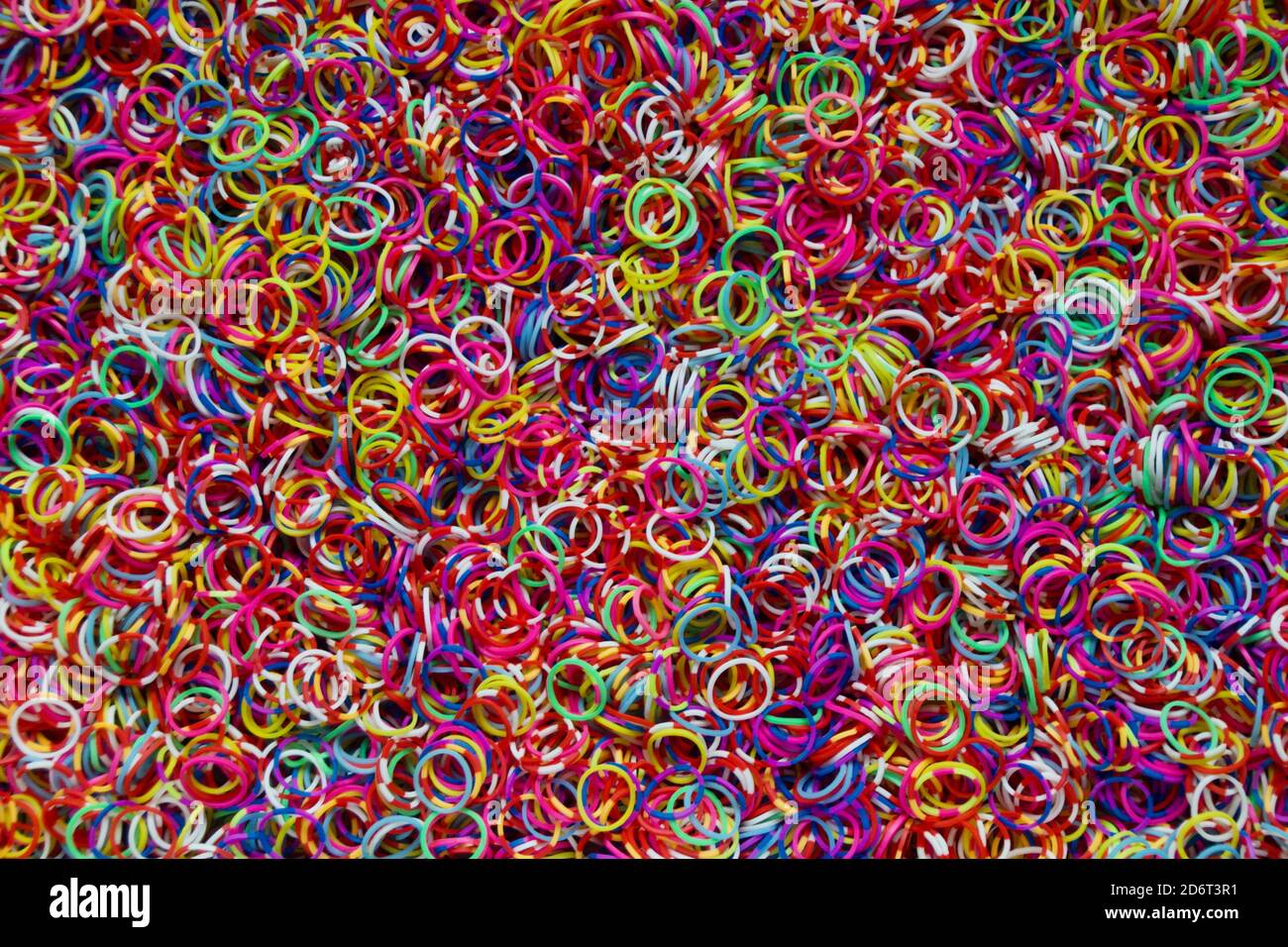 Lot of small and colored rubber bands for use as a background. Stock Photo