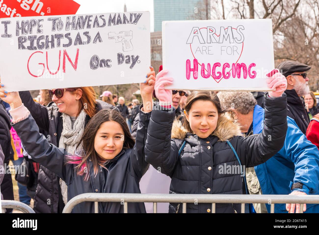 Young children holding signs at the March for Our Lives protesting easy ...