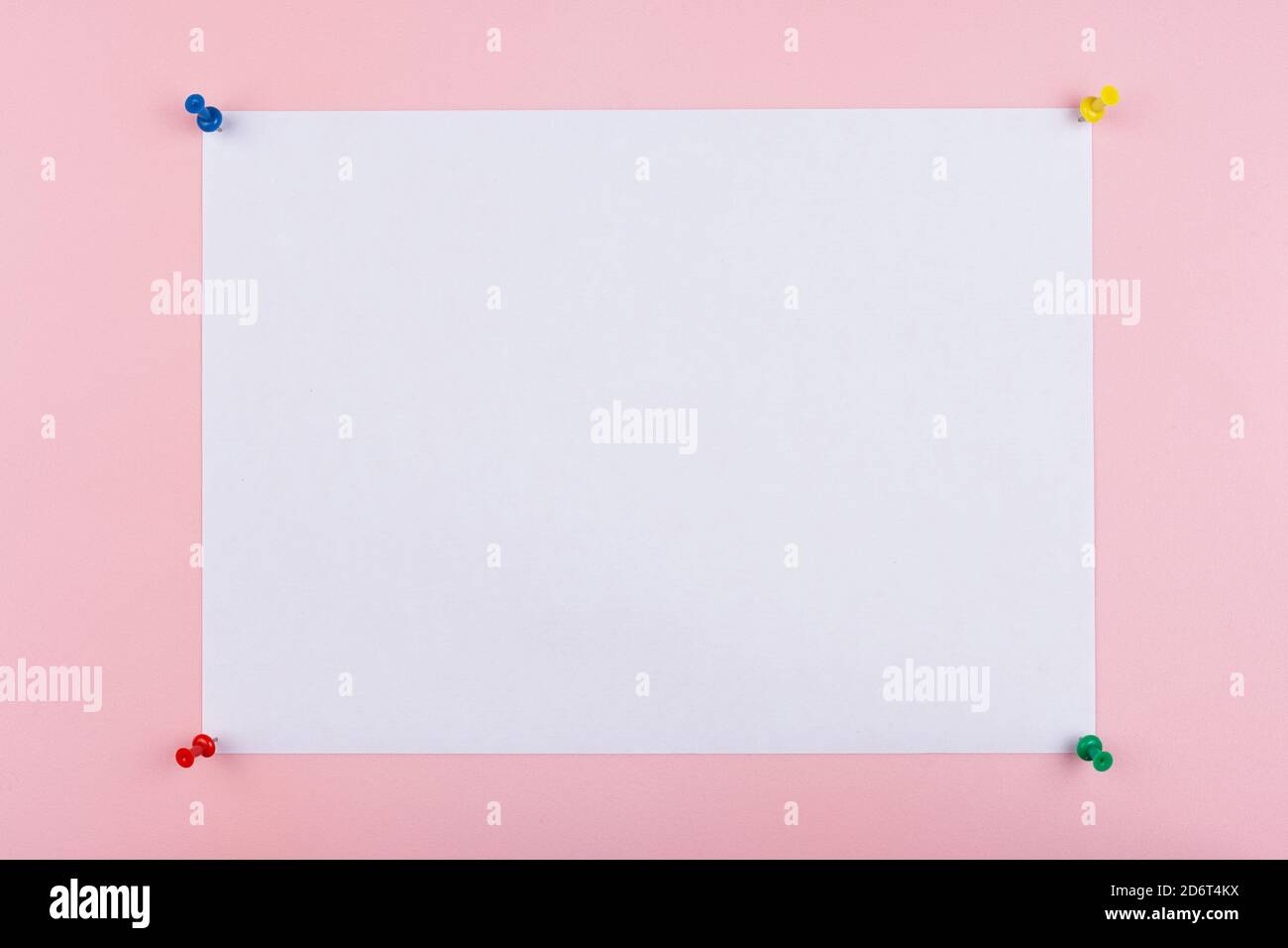 white sheet fastened with clerical multi-colored buttons Stock Photo