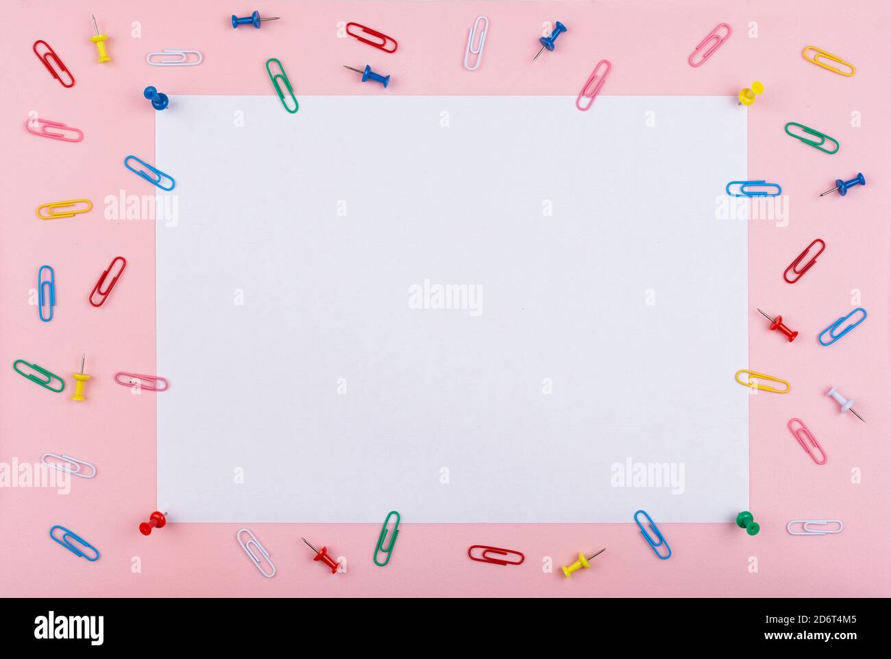 white sheet fastened with clerical multi-colored buttons Stock Photo