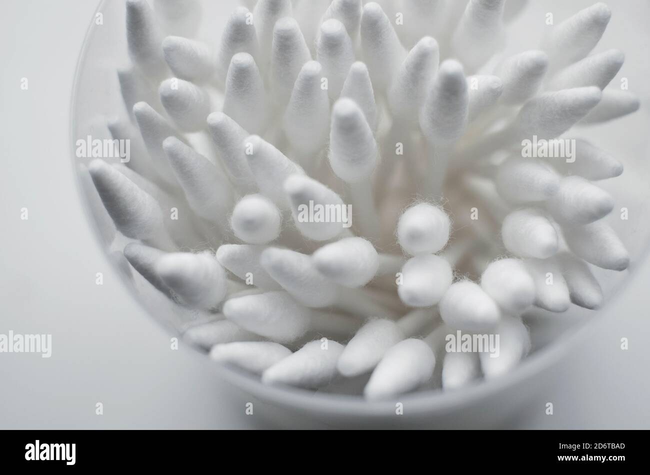 white cotton buds in plastic container Stock Photo Alamy