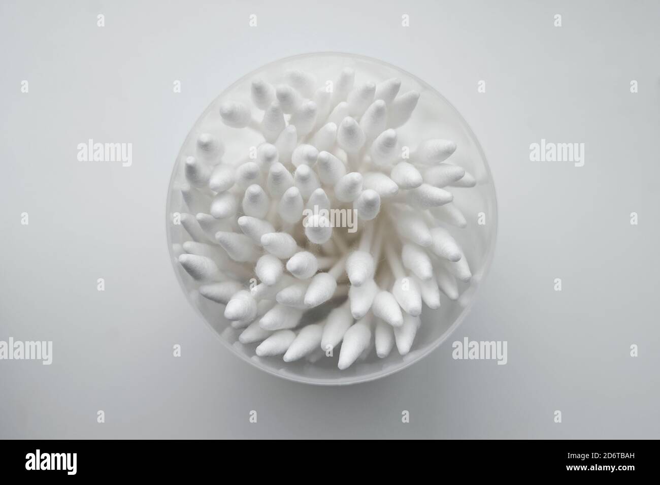 white cotton buds in plastic container Stock Photo Alamy