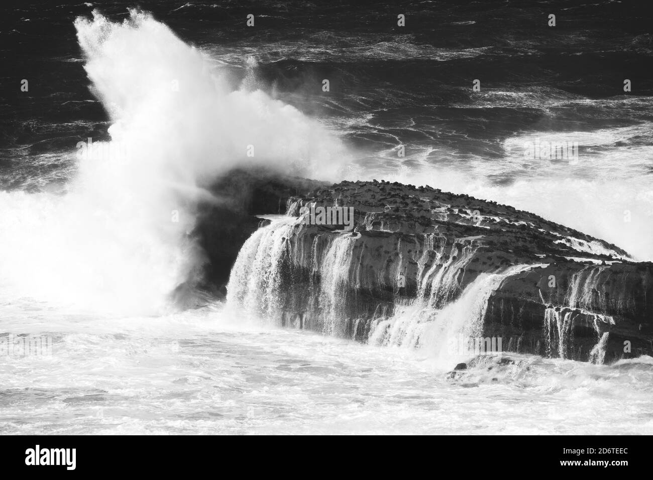 Sea storm with really big waves hitting the coast of Biarritz, at the Basque Country. Stock Photo