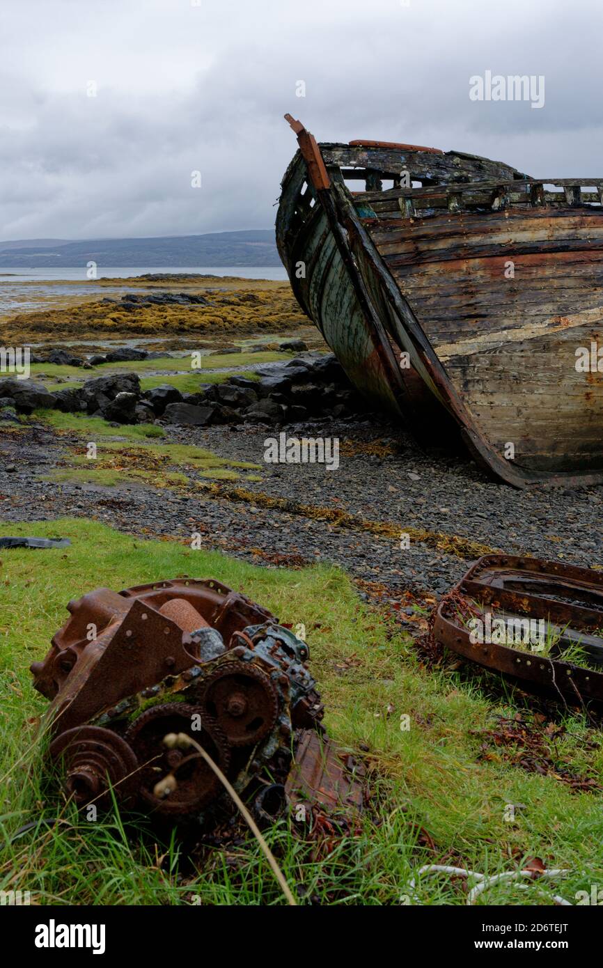 Old abandoned and decaying wooden fishing boat at Salen on the Isle of Mull in the Inner Hebrides in Western Scotland Stock Photo