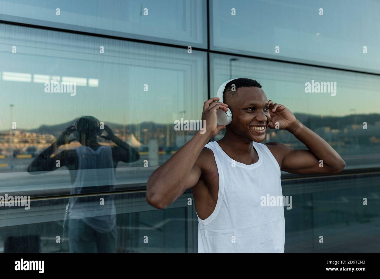 Bearded passenger using device in aircraft Stock Photo