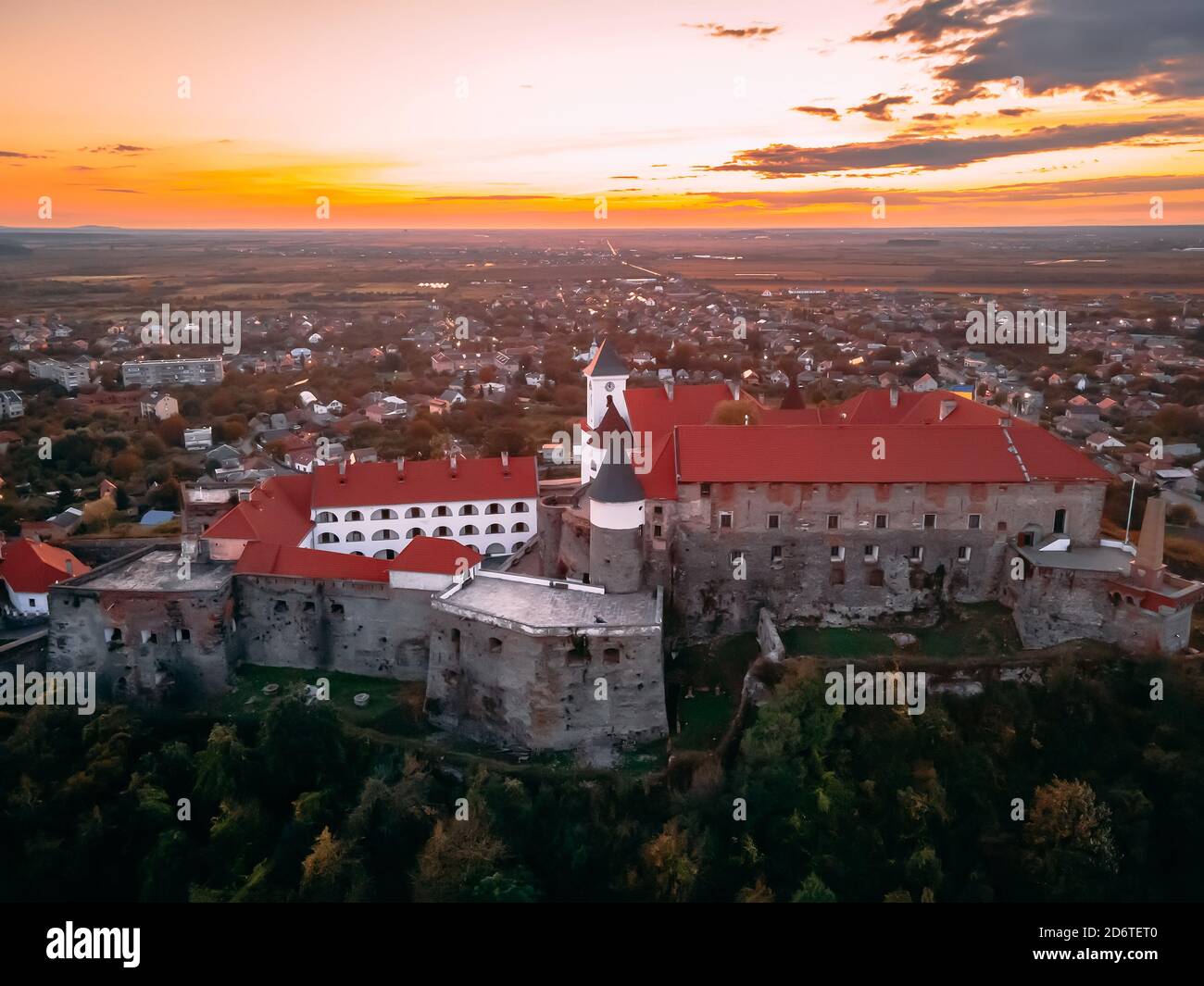 Aerial view of medieval castle on mountain in small european city in autumn season. Palanok castle, Mukachevo, Ukraine Stock Photo