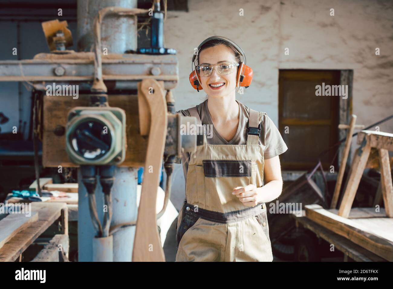 Woman Carpenter In Traditional Carpentry Adjusting The Machine Planer Stock Photo Alamy