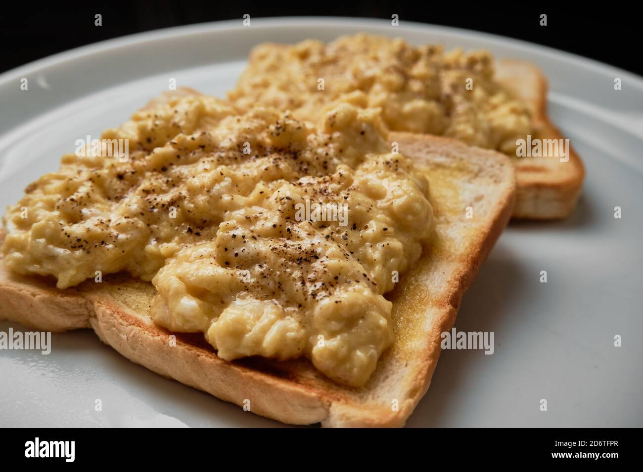 Scrambled Eggs on toast Stock Photo