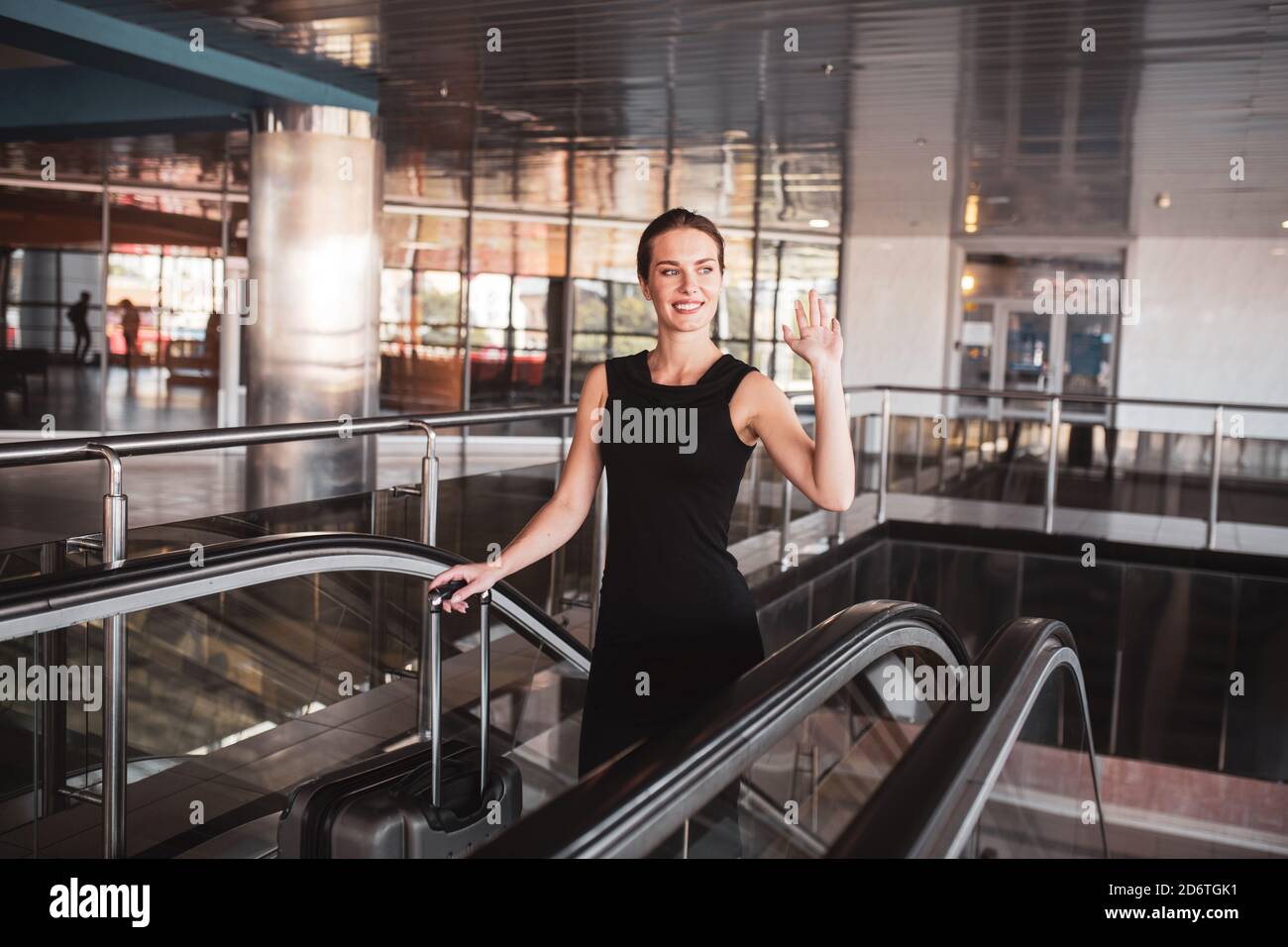 Woman airport suit check in hi-res stock photography and images - Alamy