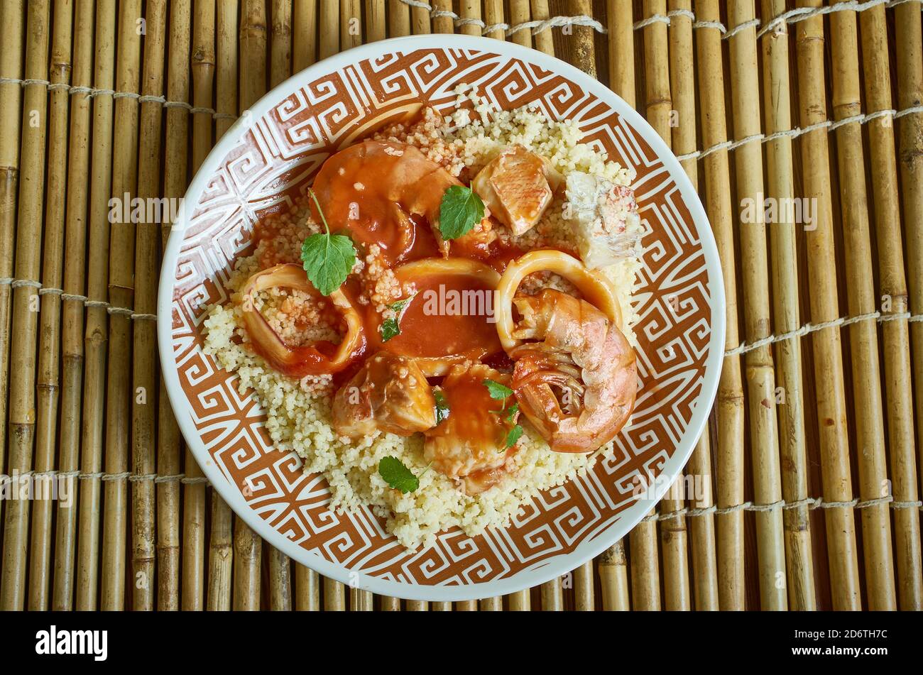 Seafood tagine Moroccan stew, served over a zesty almond couscous