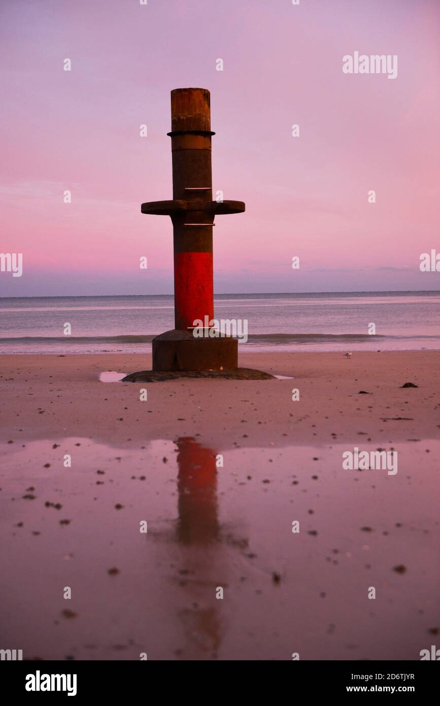 Granville (Normandy, north-western France): red diving platform on the beach at low tide, in the early morning Stock Photo
