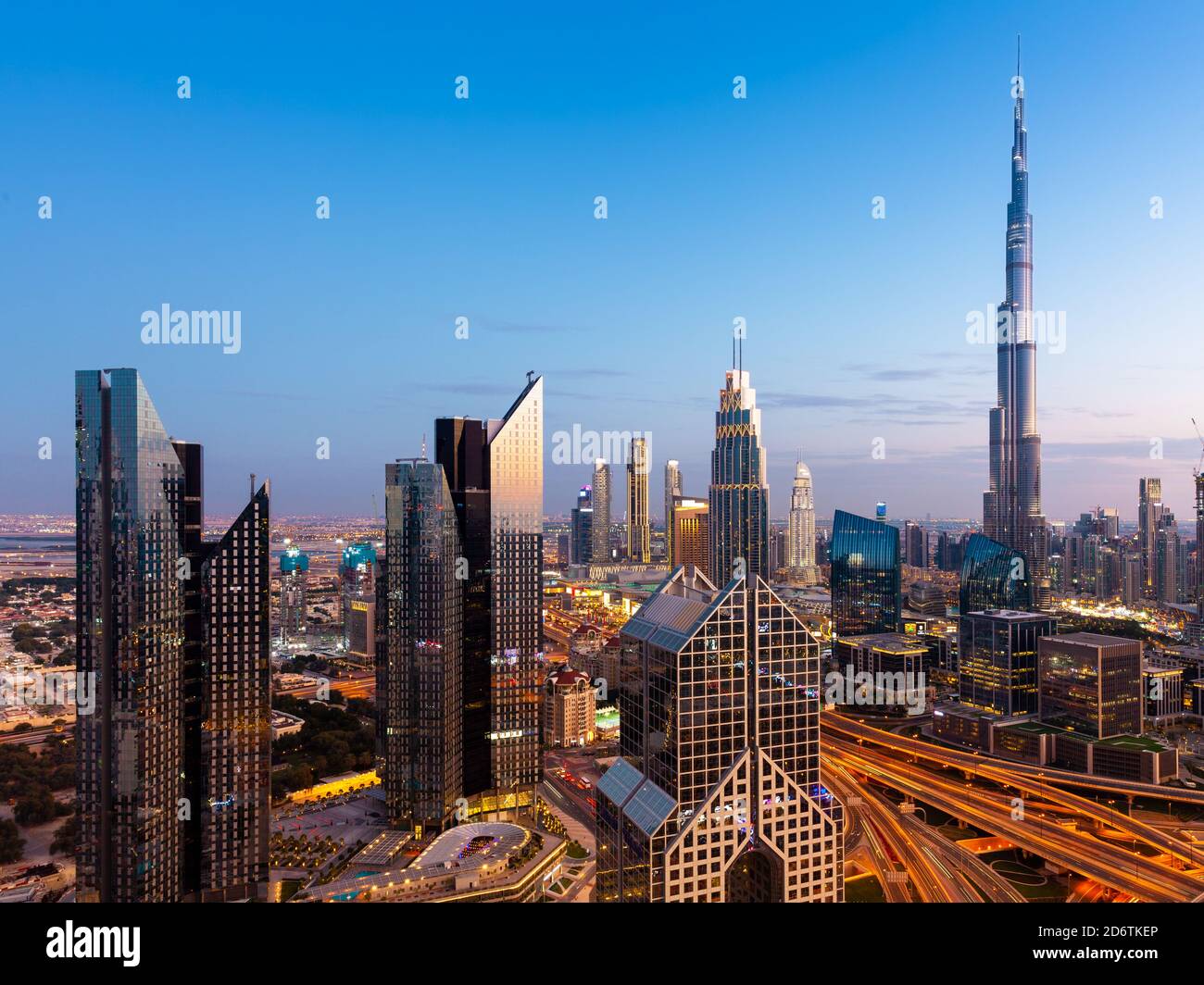 The view of the futuristic Dubai skyline at dusk, UAE. Stock Photo