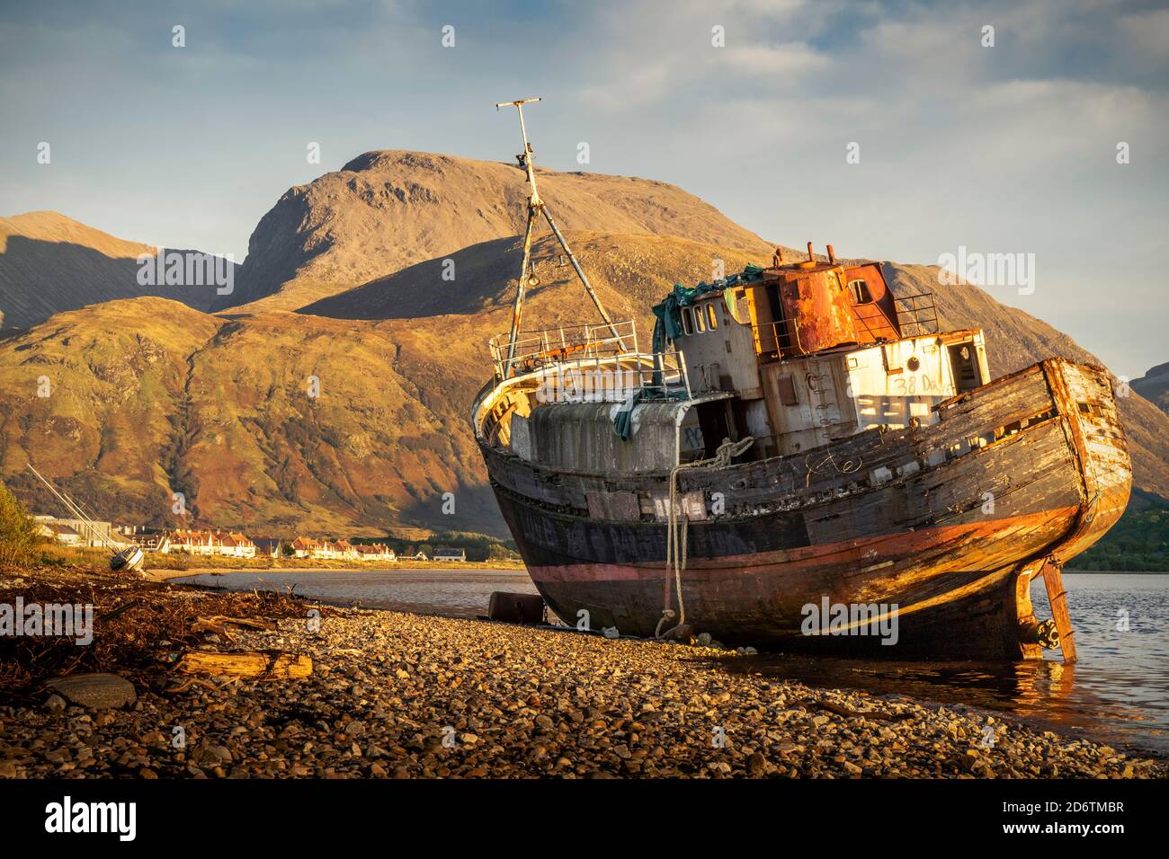 The Corpach Wreck, at Caol, in the shadow of an unusually cloud-free Ben Nevis. Stock Photo