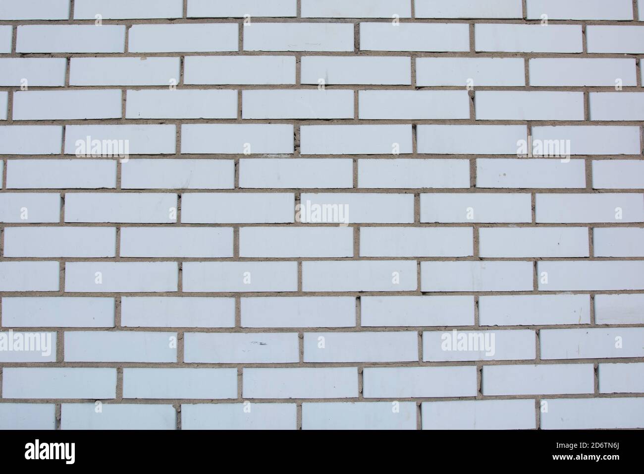 White grunge brick wall isolated texture background. Stock Photo