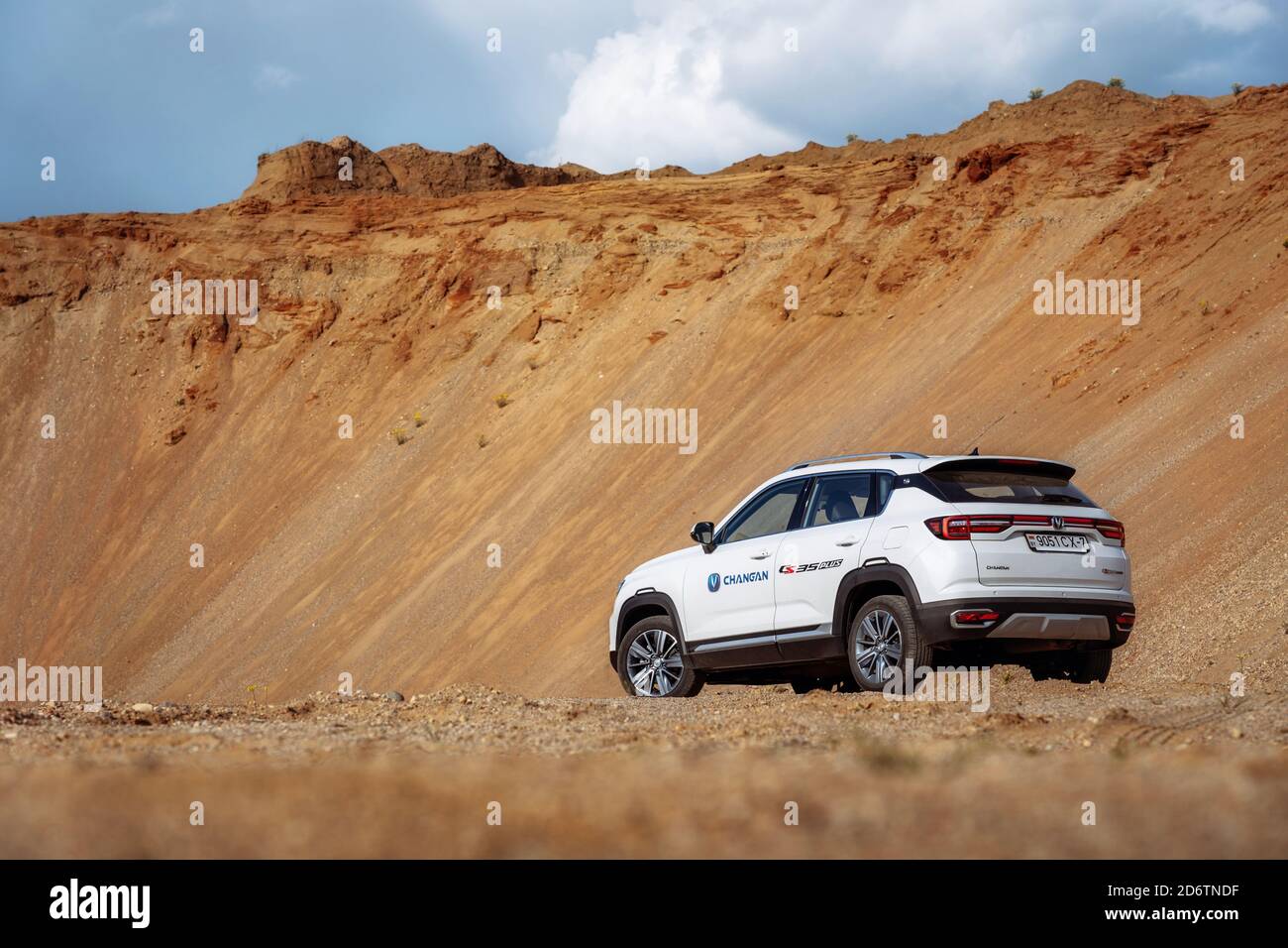Kreva, Belarus - June 1, 2020: Changan cs35 Plus on country road in desert with mountains in background Stock Photo