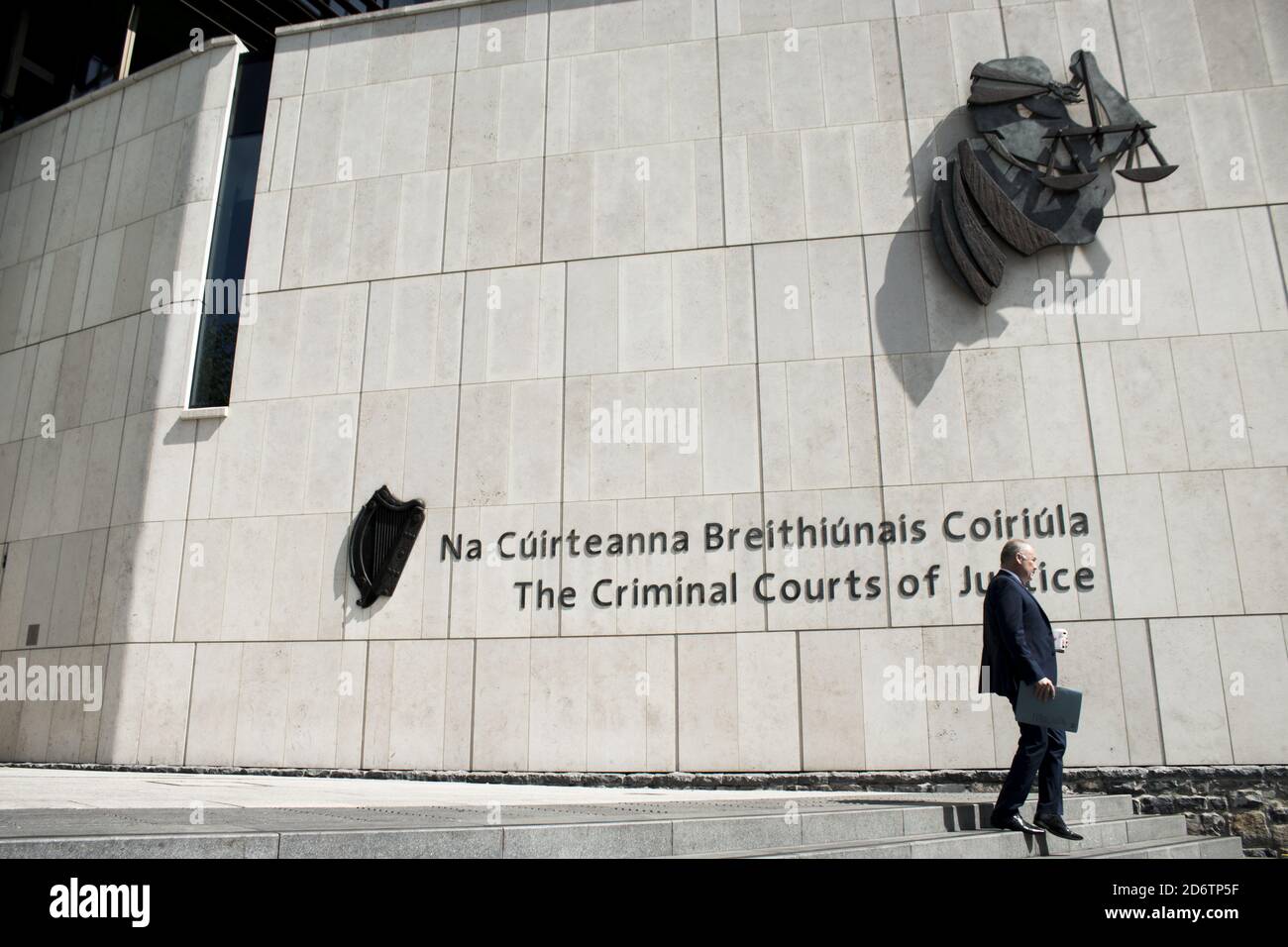 DUBLIN, IRELAND - Oct 13, 2017: An unidentified man walking down the stairs of The criminal courts of justice, Dublin, Ireland. Also known as Dublin's Stock Photo
