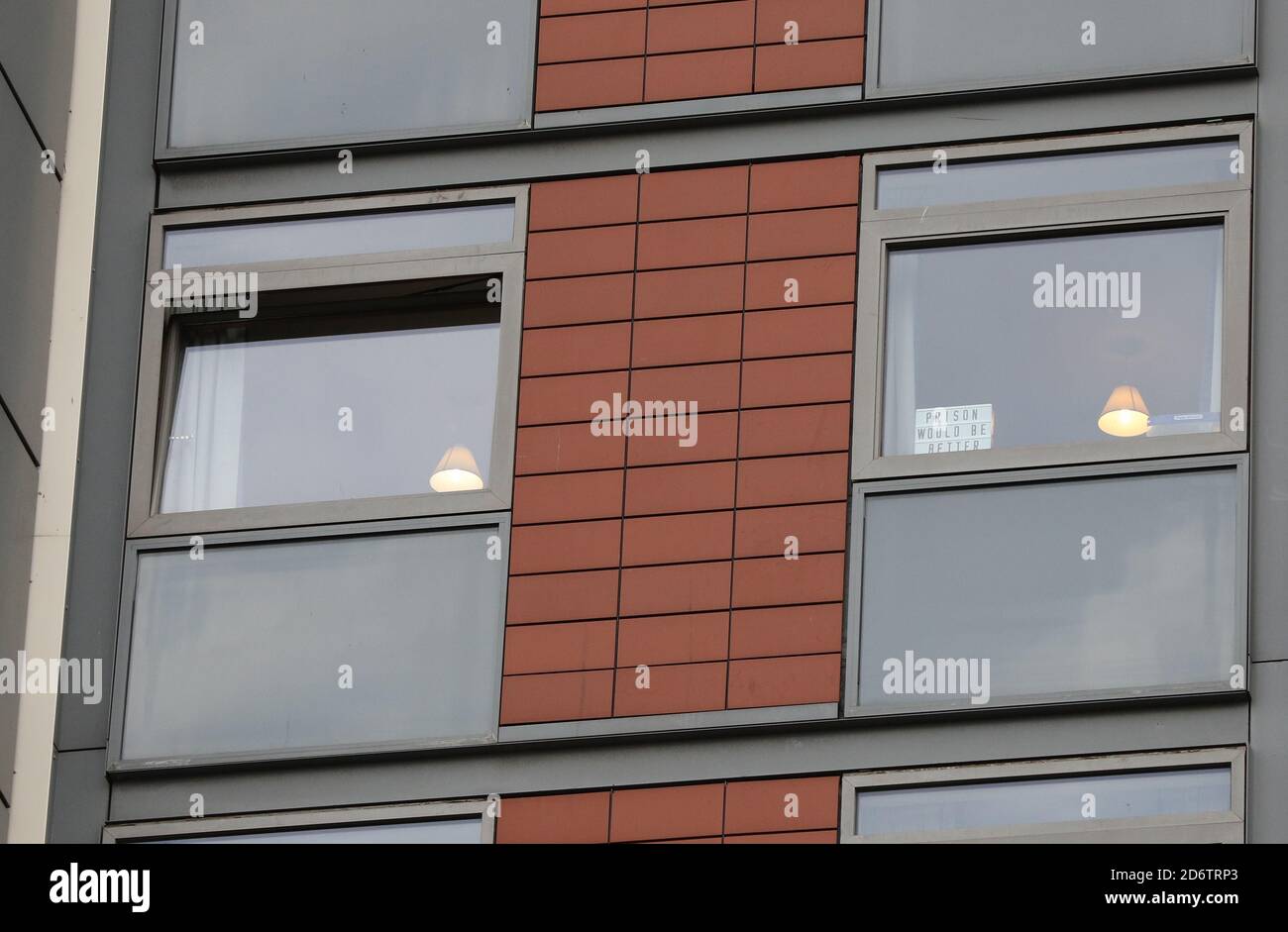 A message in a window of the student Block F in the Paragon estate in Brentford, west London, to pack before leaving to go to a hotel, after residents were asked to 'immediately' leave their homes due to fire safety concerns. Stock Photo