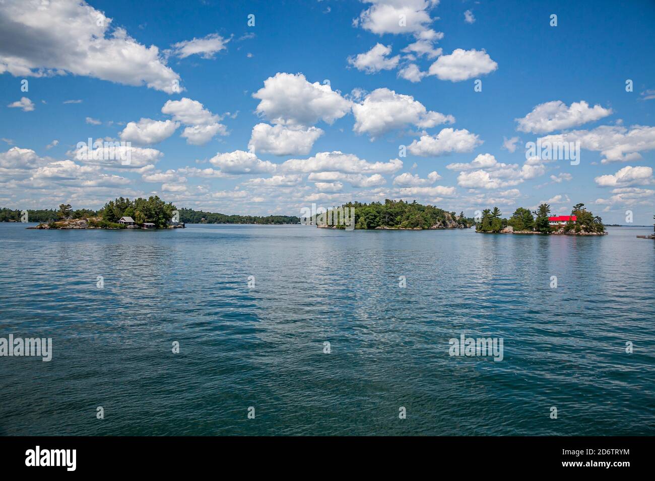 Thousand islands with their cottages along the St Lawrence river and US