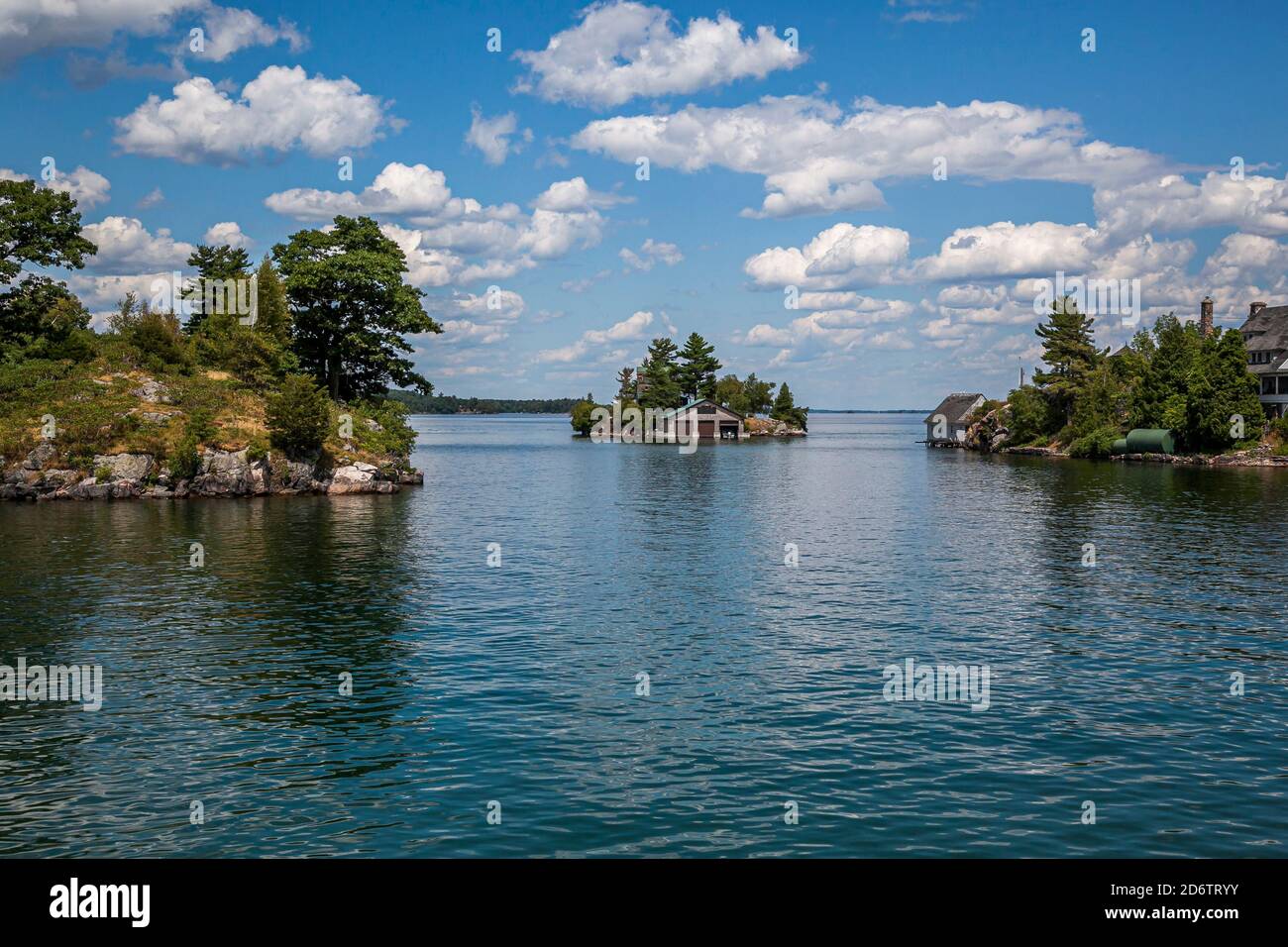 Thousand islands with their cottages along the St Lawrence river and US