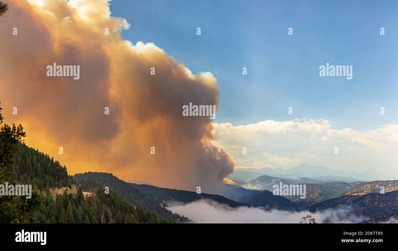 Smoke rises out of the Left Hand Canyon as a wildfire burns in Colorado Stock Photo
