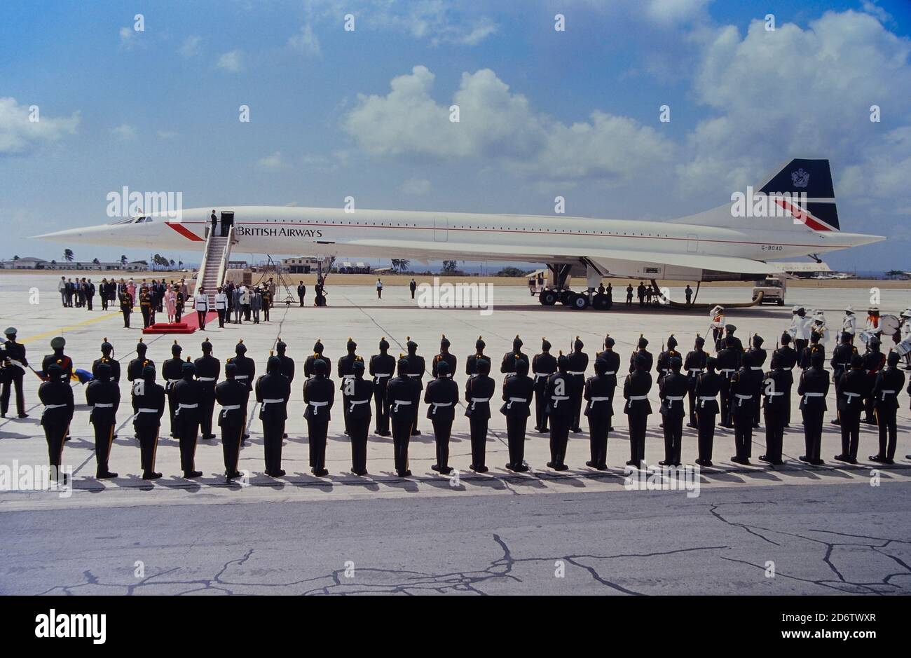 Queen Elizabeth II  and Prince Philip at the airport leaving ceremony in Barbados before departing in different directions, March 11, 1989. The Queen returned to England via British Airways Concorde while Prince Philip went on to Bermuda to present the Duke of Edinburgh awards. They were on the Caribbean island for a four-day visit. Stock Photo