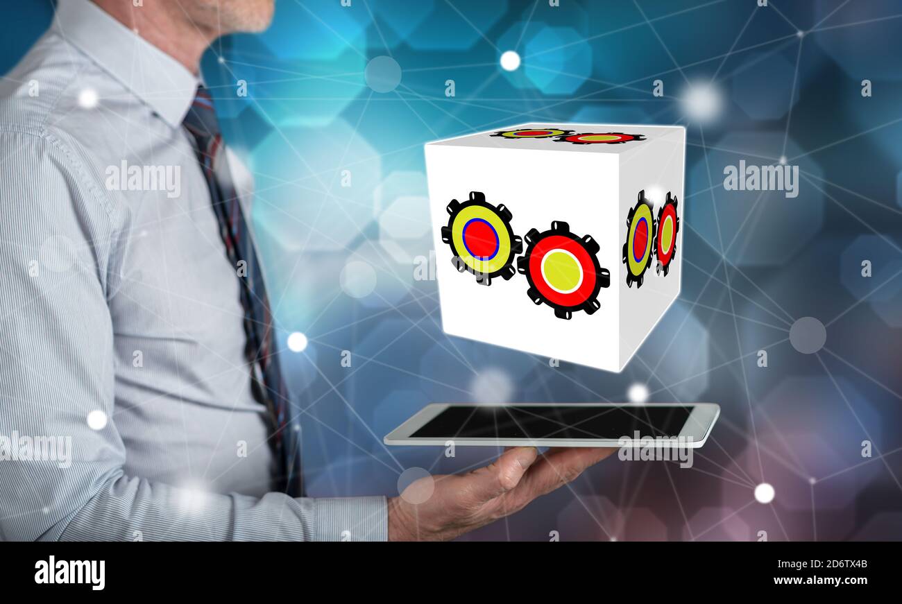 Business process concept above a tablet held by a man Stock Photo