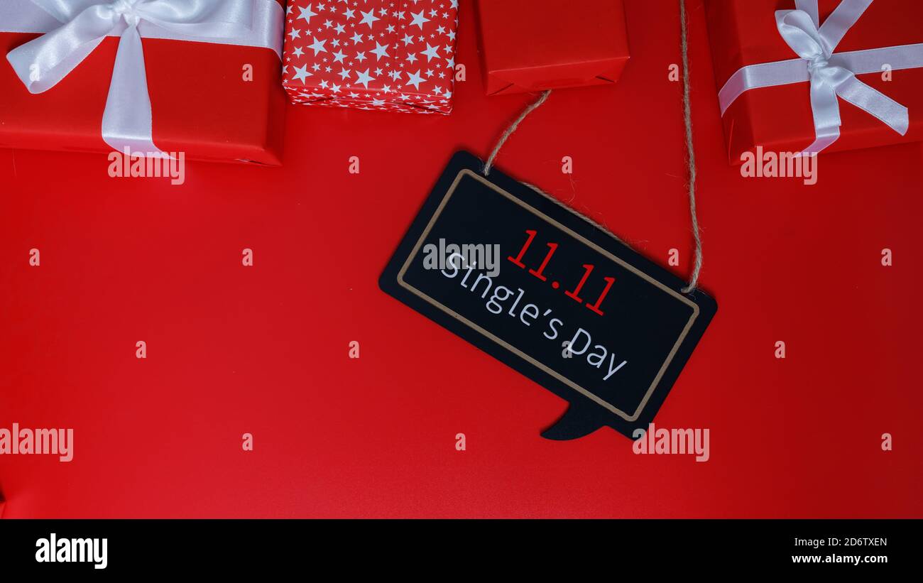 Online shopping of China, 11.11 single's day sale concept. The red gift boxes on red background with copy space for text 11.11 single's day sale. Stock Photo