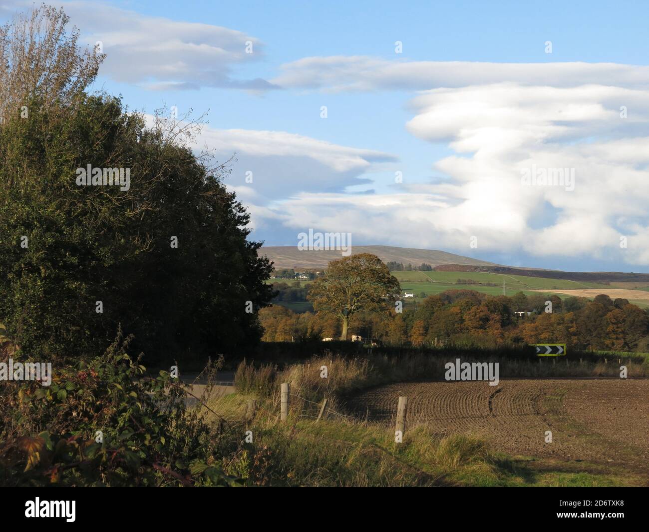 Just a few miles north of Glasgow, there is gentle rolling countryside, ploughed fields and the Campsies in the distance; October 2020 Stock Photo