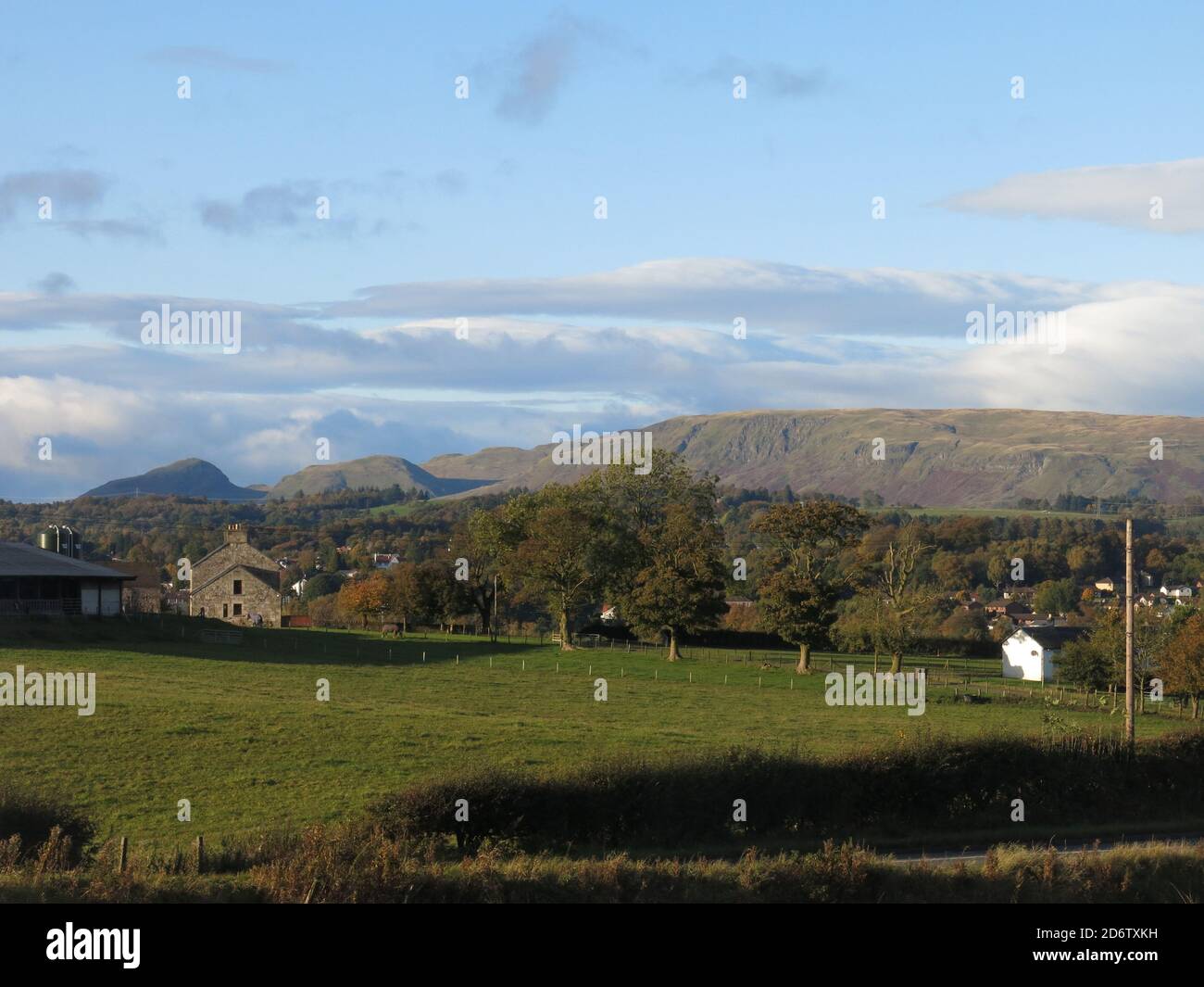 Looking north towards the Campsie Fells across the countryside of Central Scotland; the prominent shape of Dumgoyne is visible on the left. Stock Photo