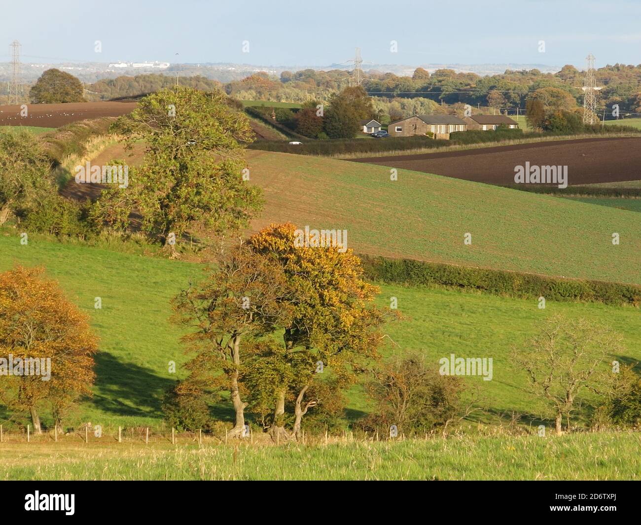 The rural scenery of Scotland's central belt on a sunny day in early autumn: rolling hills, ploughed fields and blue skies. Stock Photo