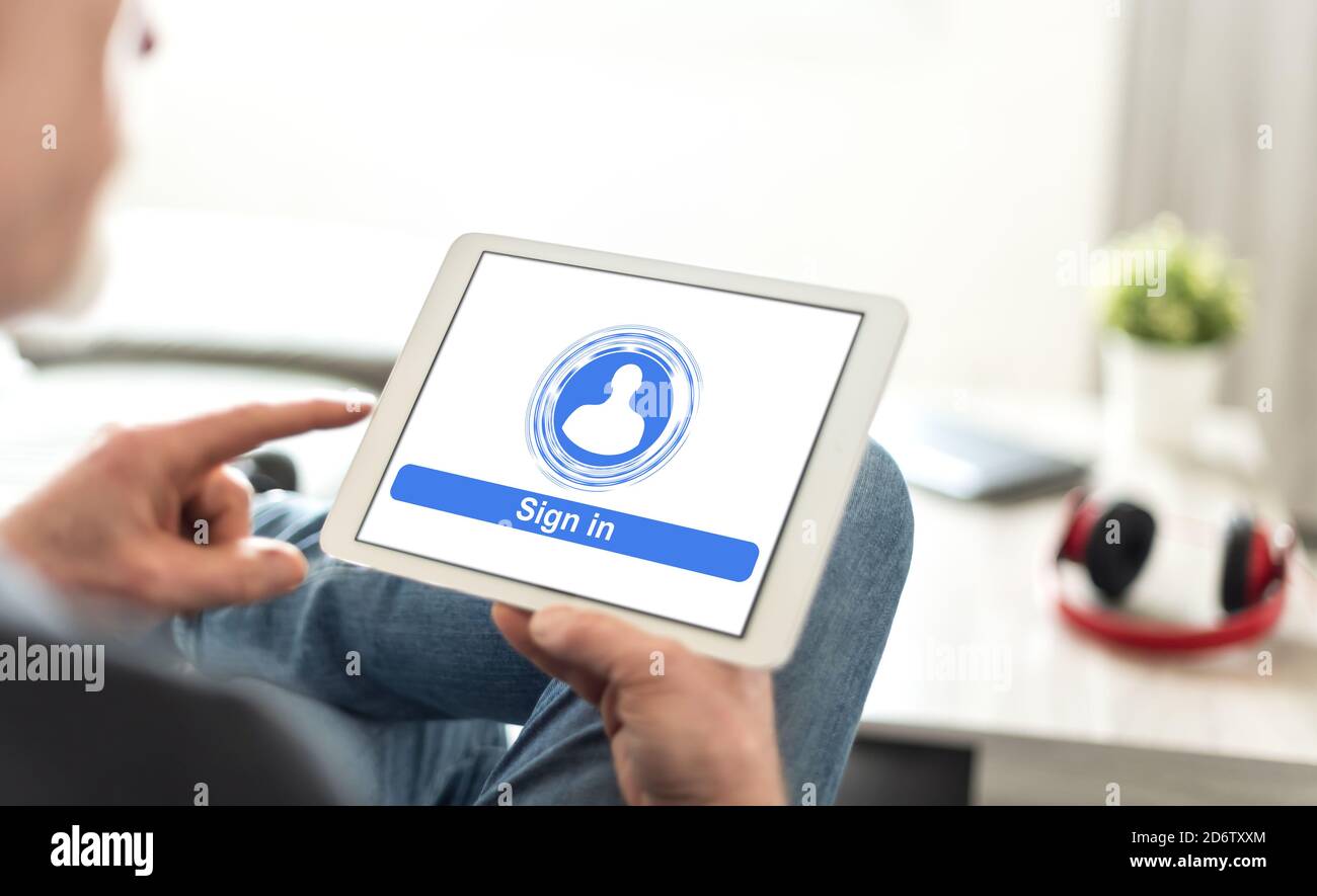 Tablet screen displaying a sign in concept Stock Photo - Alamy