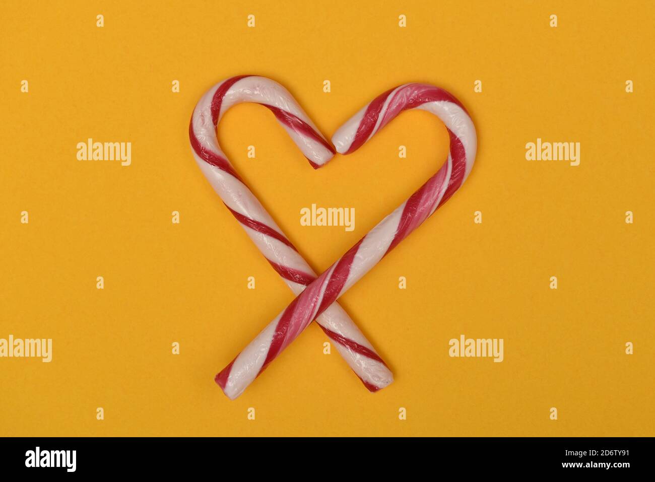 Christmas candy cane shaped as a heart bow Stock Photo