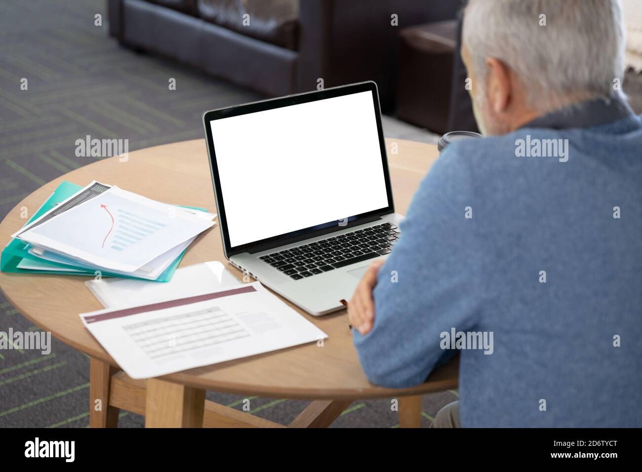 Senior businessman using laptop at modern office Stock Photo