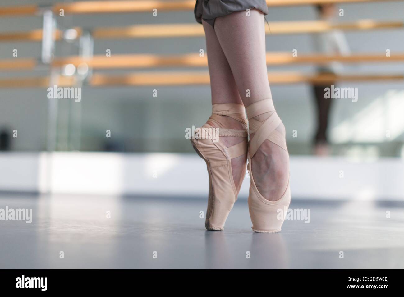 female ballerina feet in pointe shoes on point position, close up detail  shot Stock Photo - Alamy