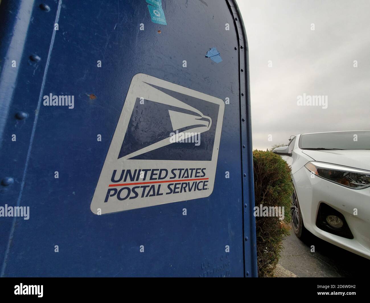 Wide angle of logo for United States Postal Service (USPS) on mailbox