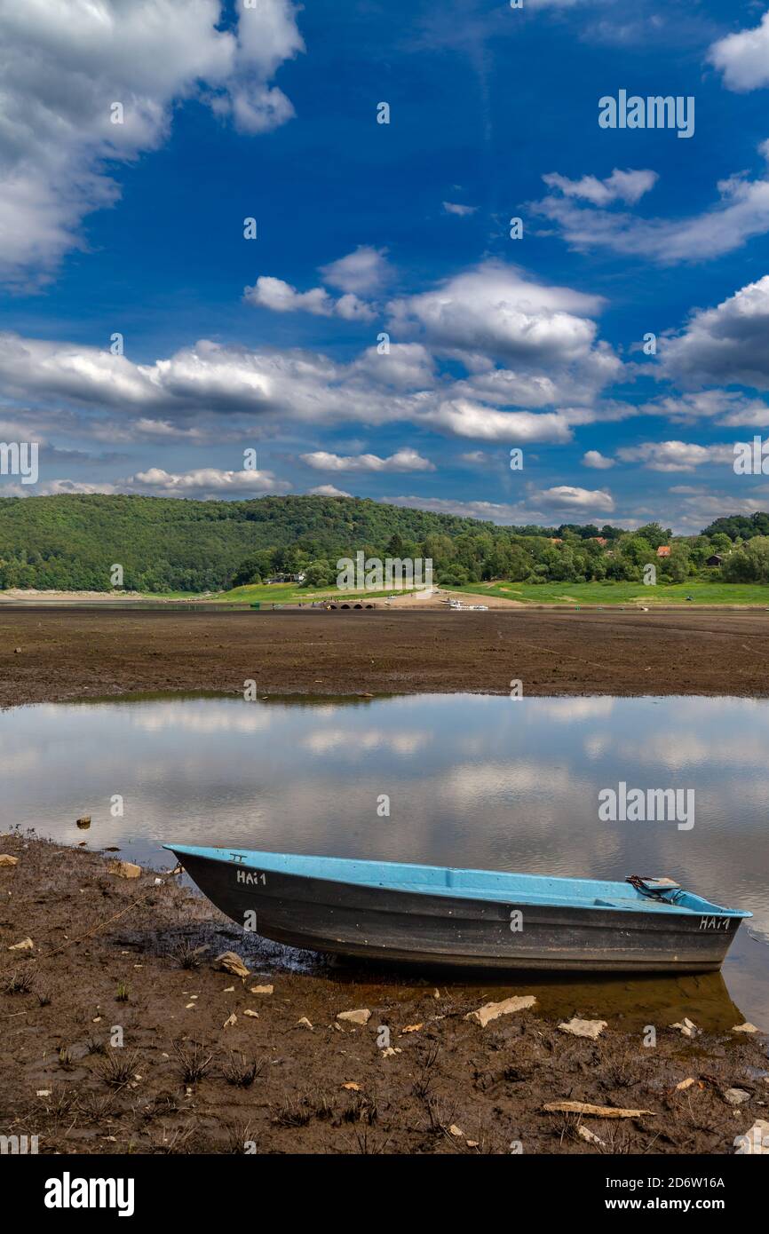 Boat on the sea ground at very low water levels in the Edersee in northern Hesse, Germany. Stock Photo