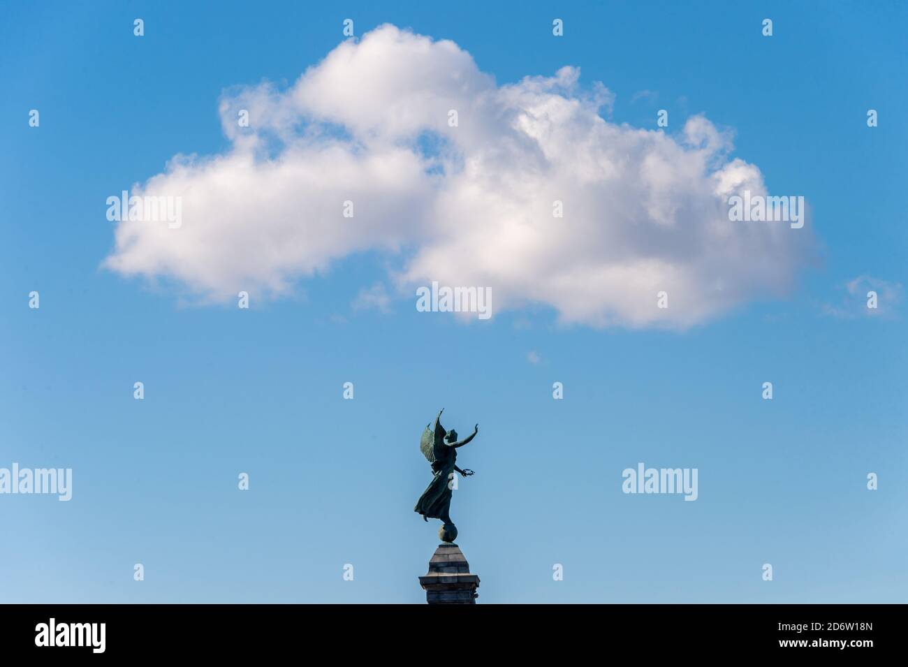 White cloud over Angel Statue in Montreal in Mont Royal Park Stock Photo